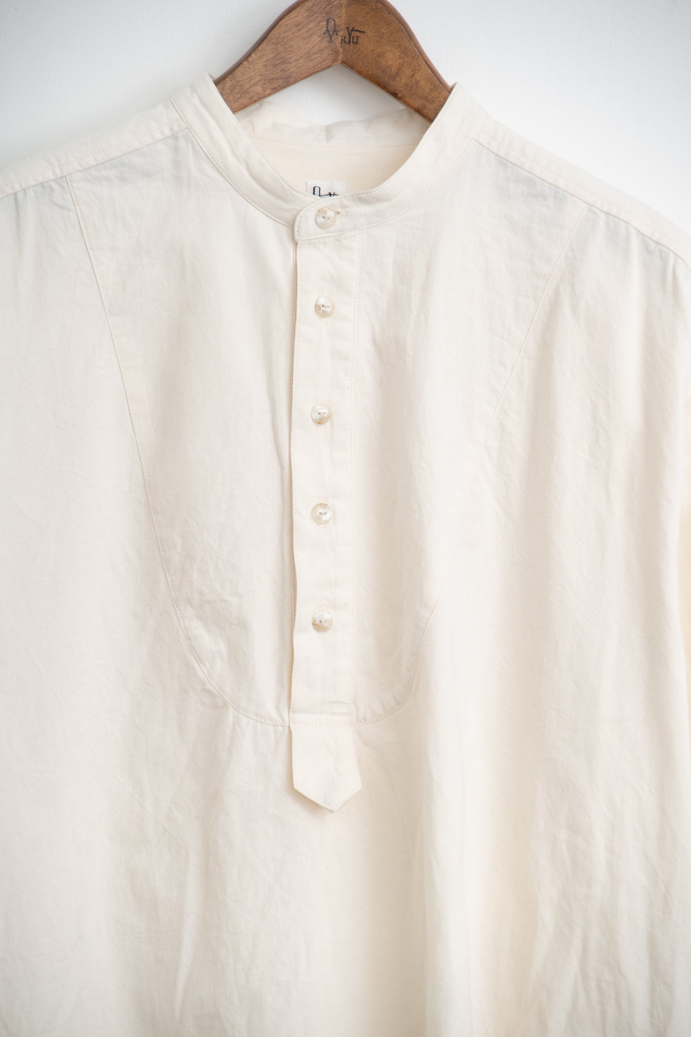 band collar over bosom shirt