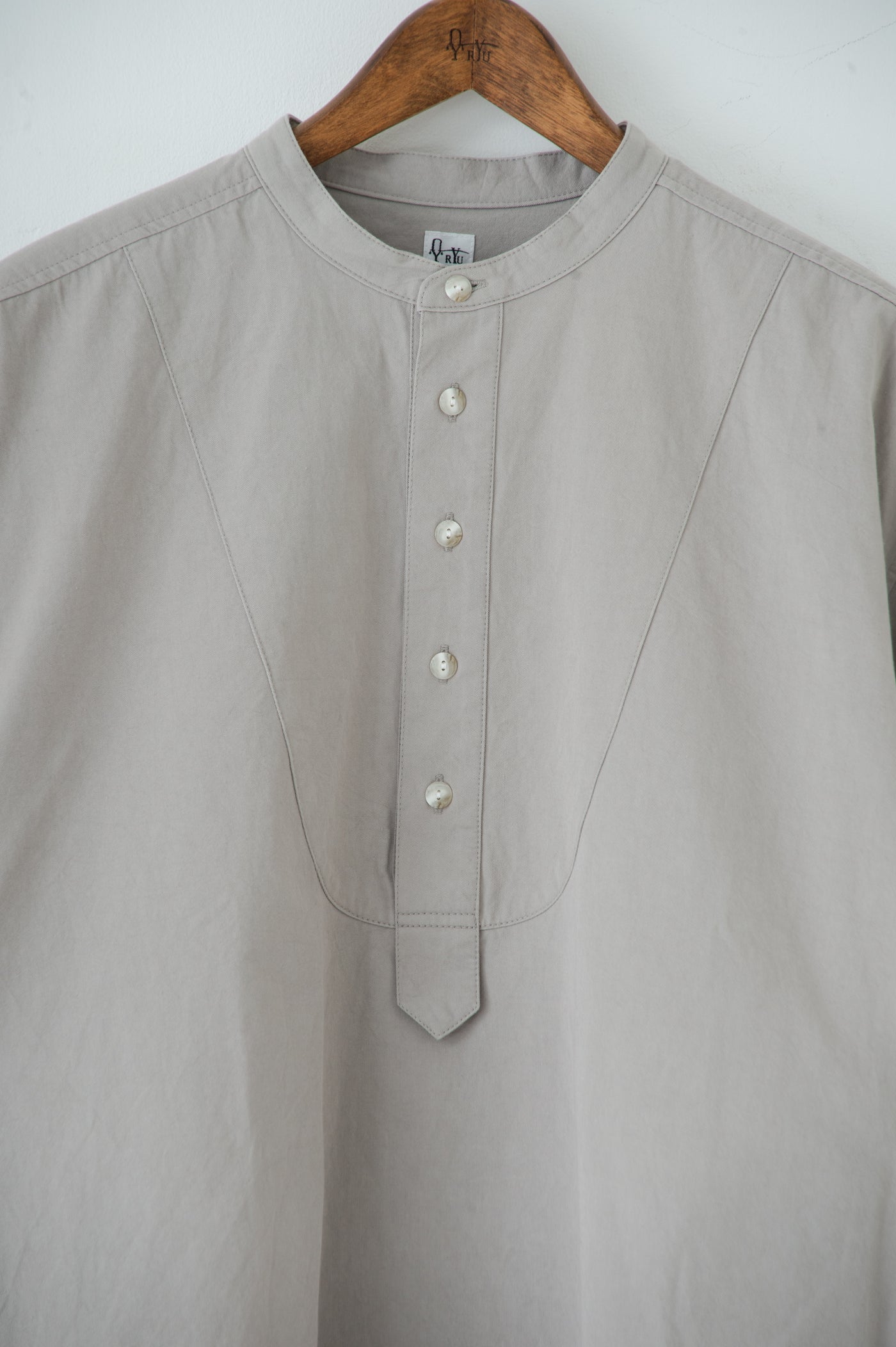 band collar over bosom shirt